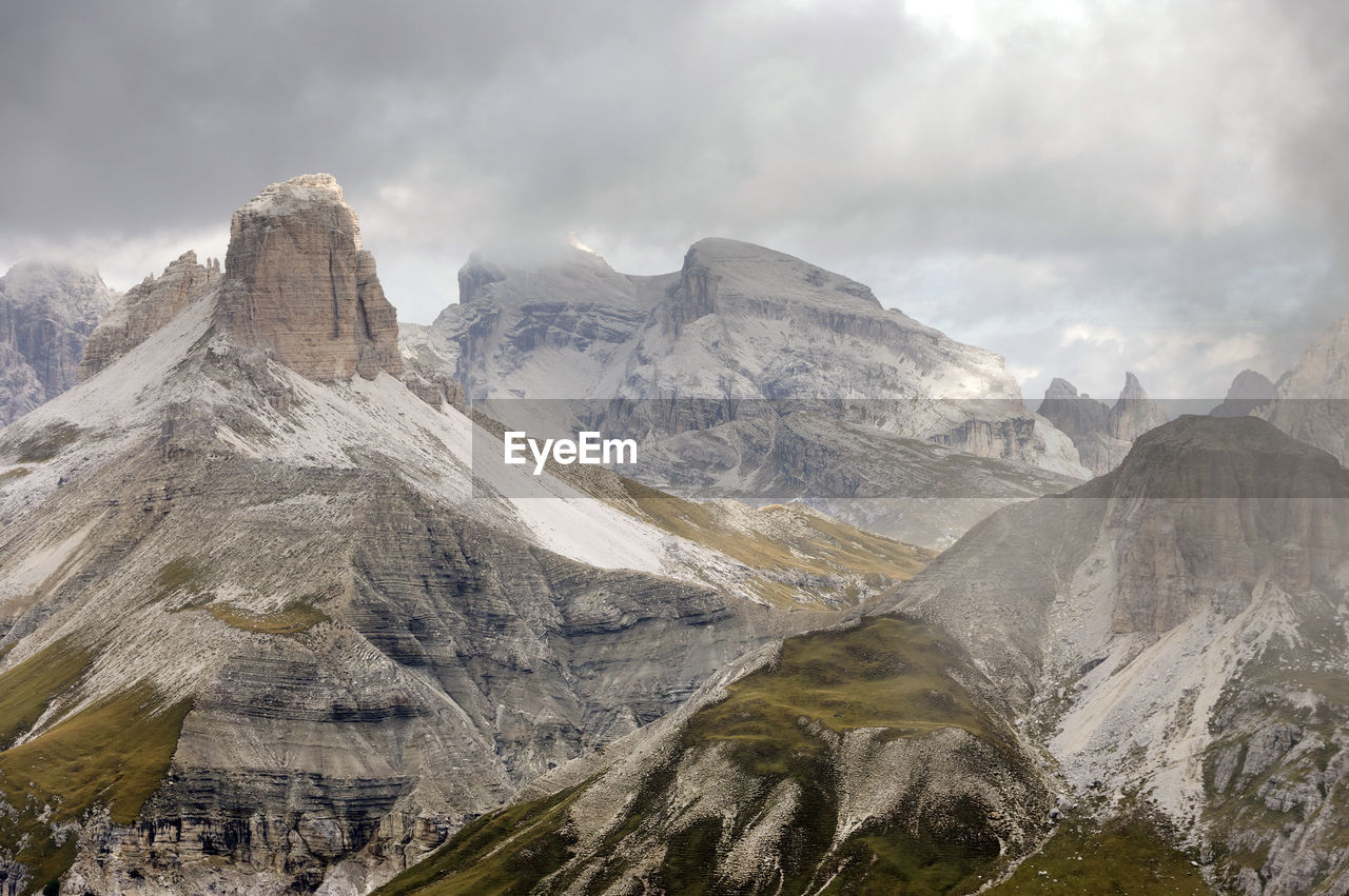 High angle shot of rocky landscape against clouds