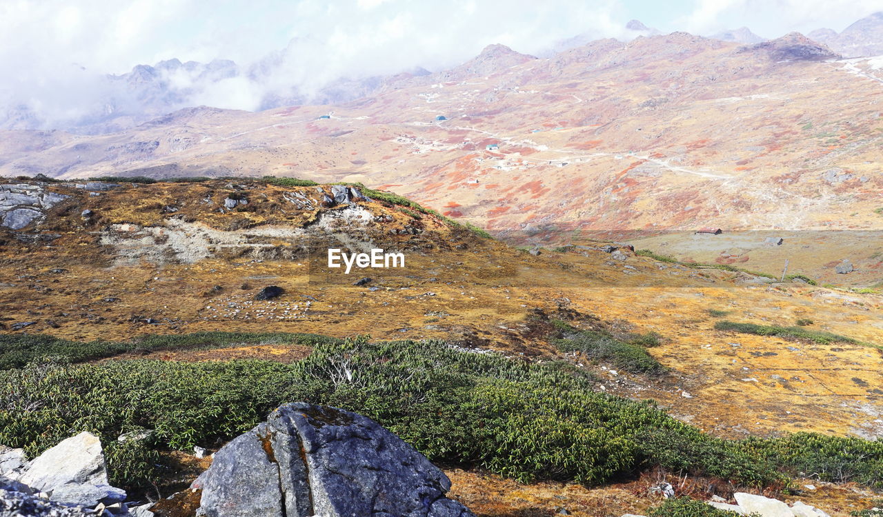 mountain, scenics - nature, landscape, environment, beauty in nature, nature, rock, cloud, tranquility, land, tranquil scene, non-urban scene, mountain range, wilderness, sky, no people, travel destinations, day, ridge, geology, valley, travel, plateau, mountain pass, plant, outdoors, walking, idyllic, remote, high angle view, tourism, adventure, rock formation