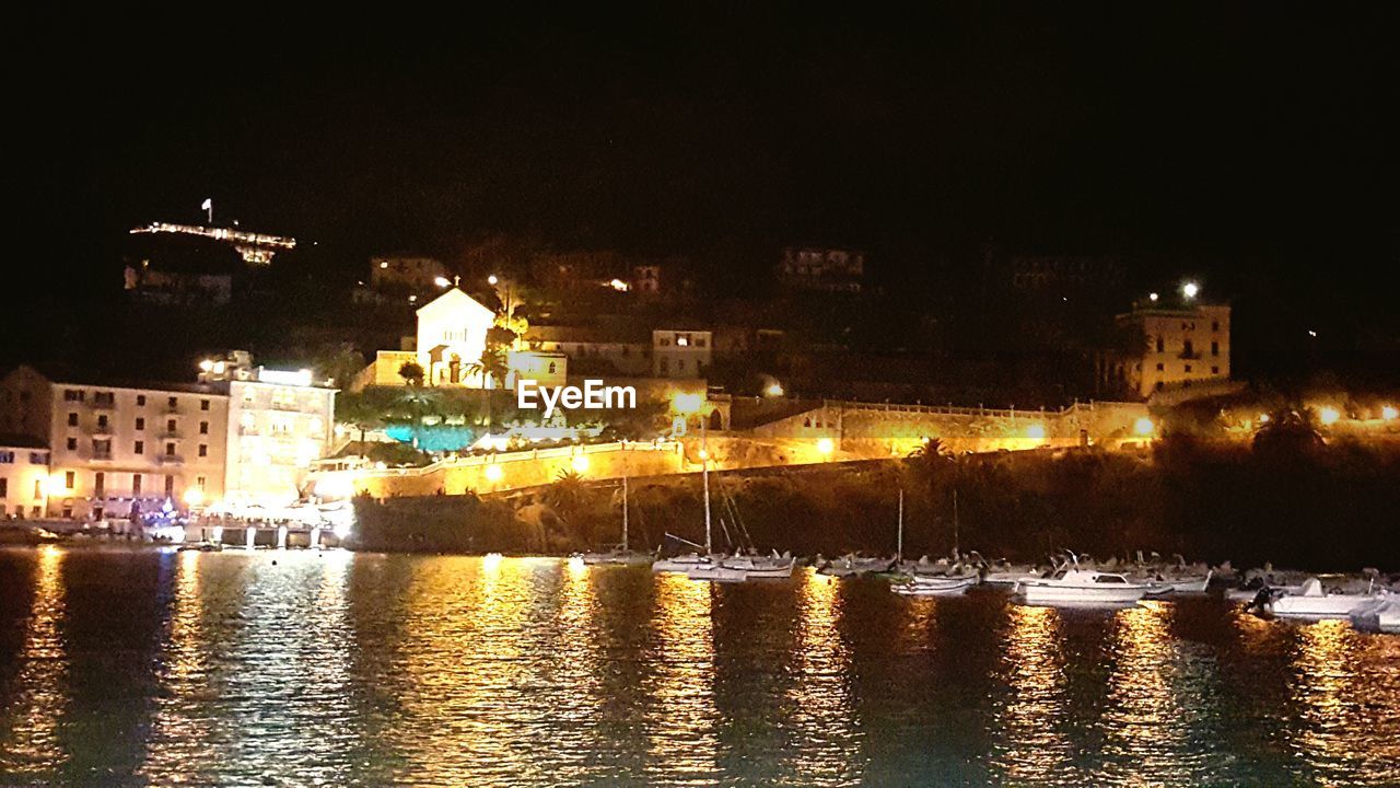 VIEW OF ILLUMINATED BUILDINGS AT NIGHT