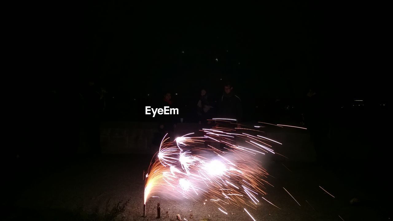 Illuminated fireworks at night