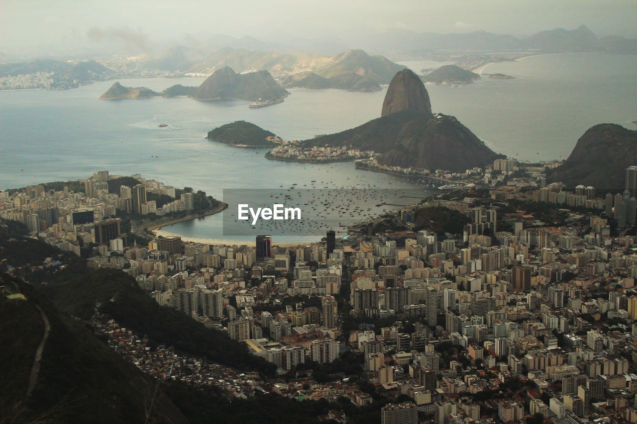 Aerial view of cityscape by sugarloaf mountain at guanabara bay