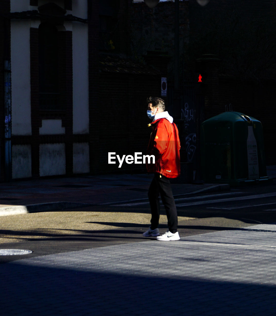 FULL LENGTH OF MAN STANDING ON STREET