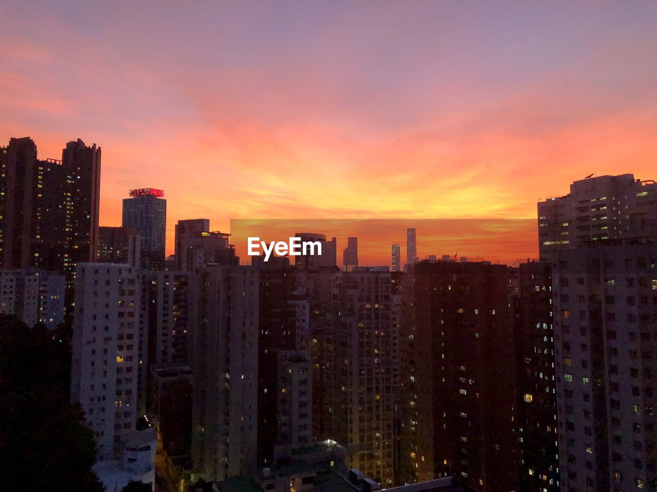 Cityscape against sky during sunset