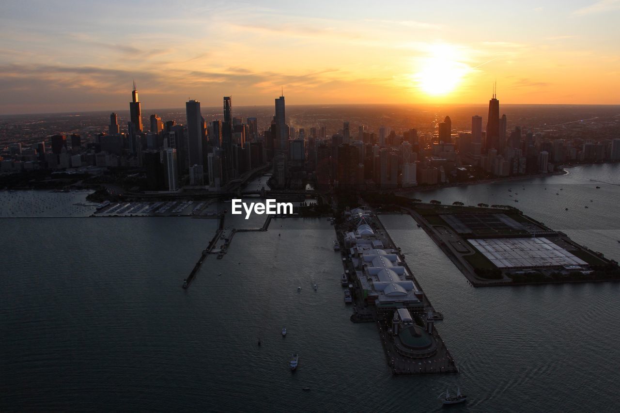 MODERN BUILDINGS IN CITY AT SUNSET