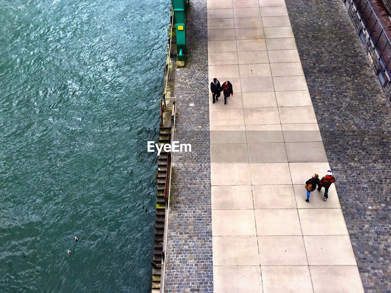 High angle view of people walking on promenade by rhine river