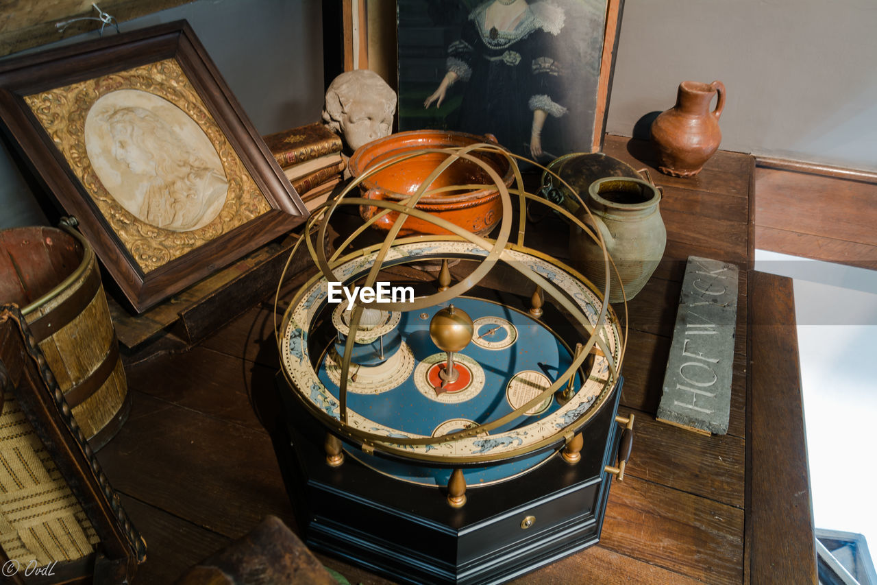 High angle view of antique objects on table