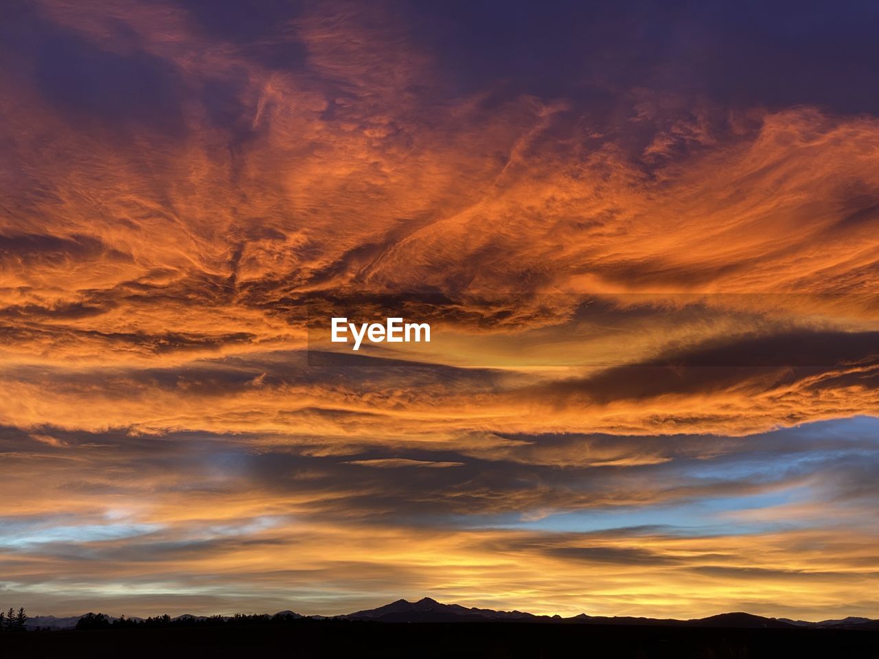 Low angle view of dramatic sky during sunset