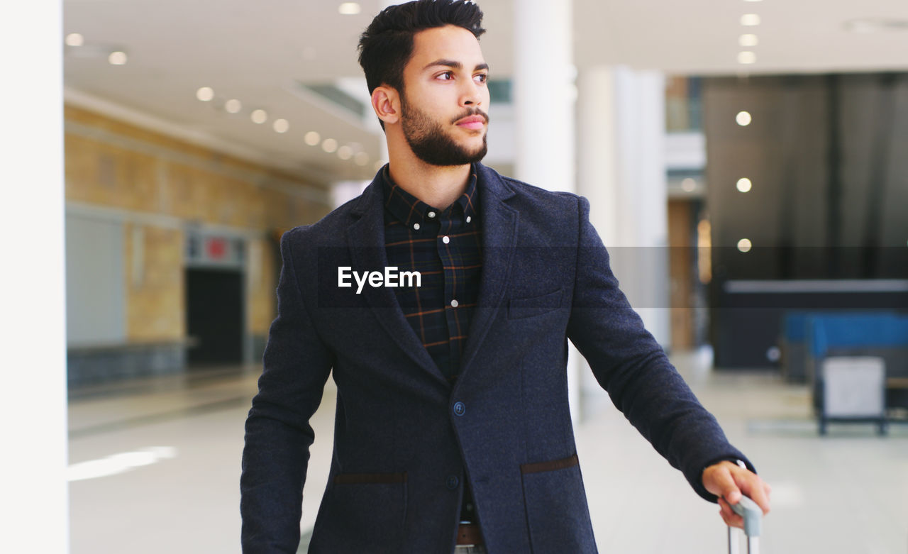 Handsome man looking away wearing suit