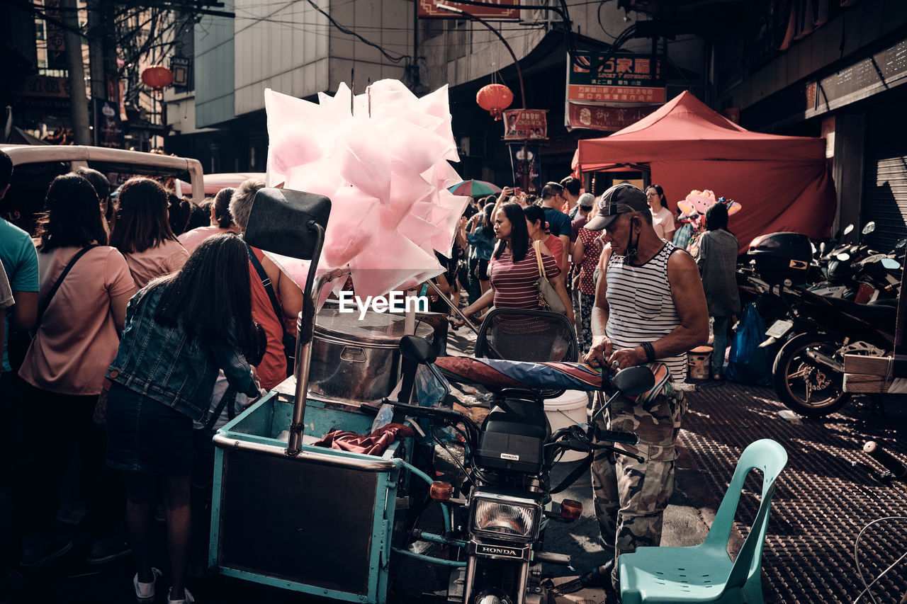 GROUP OF PEOPLE AT MARKET