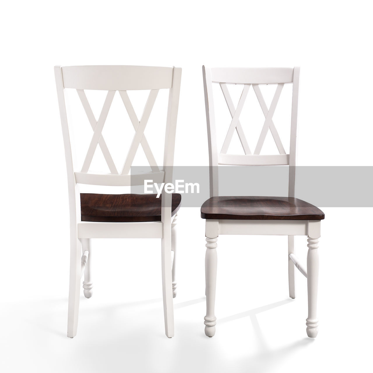 EMPTY TABLES AND CHAIRS AGAINST WHITE BACKGROUND