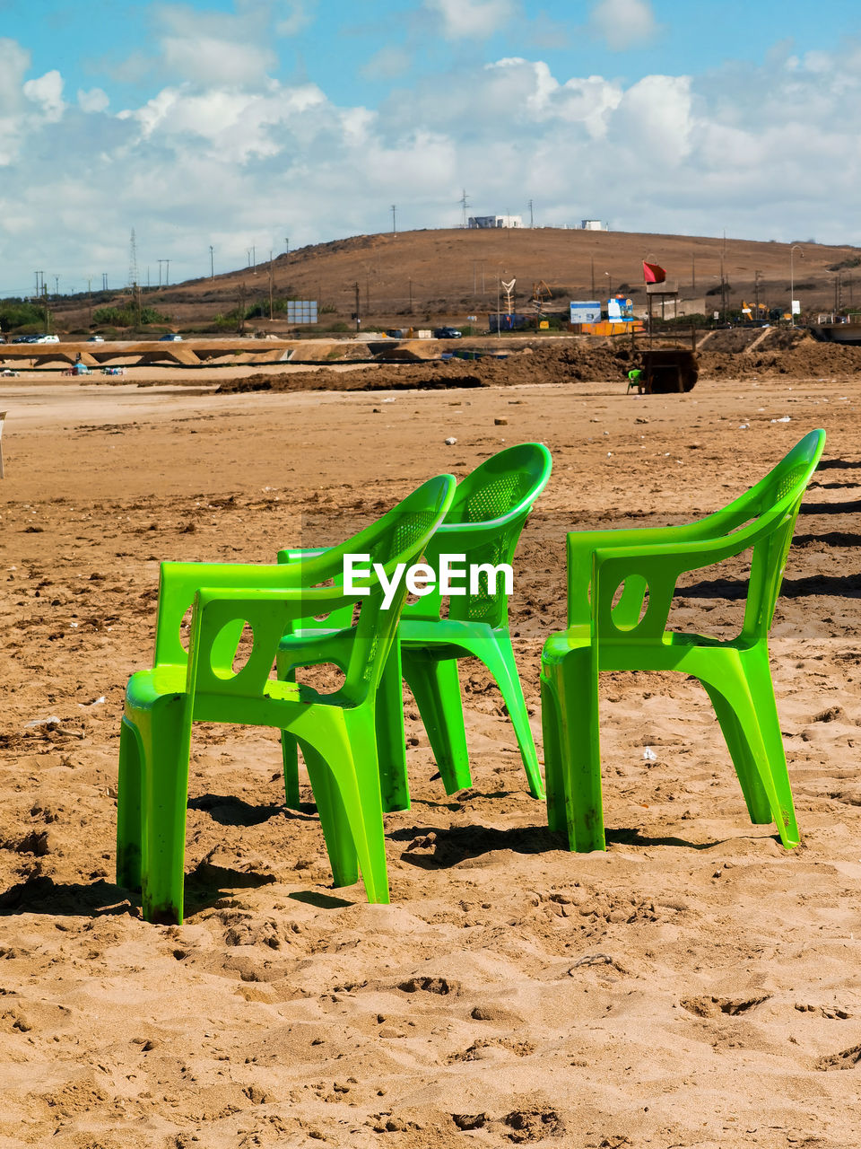 Green chairs on the beach