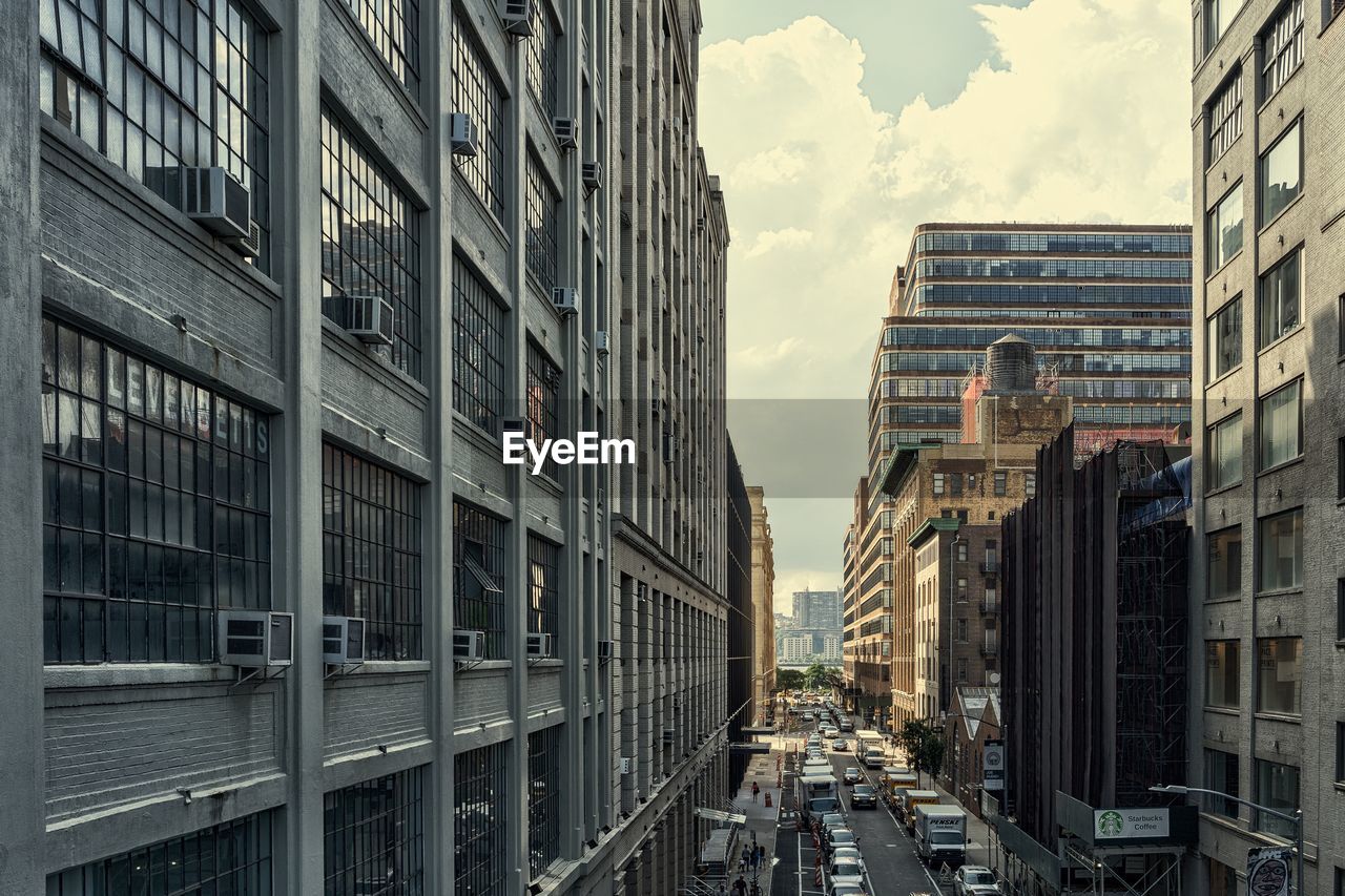 Street amidst buildings against sky