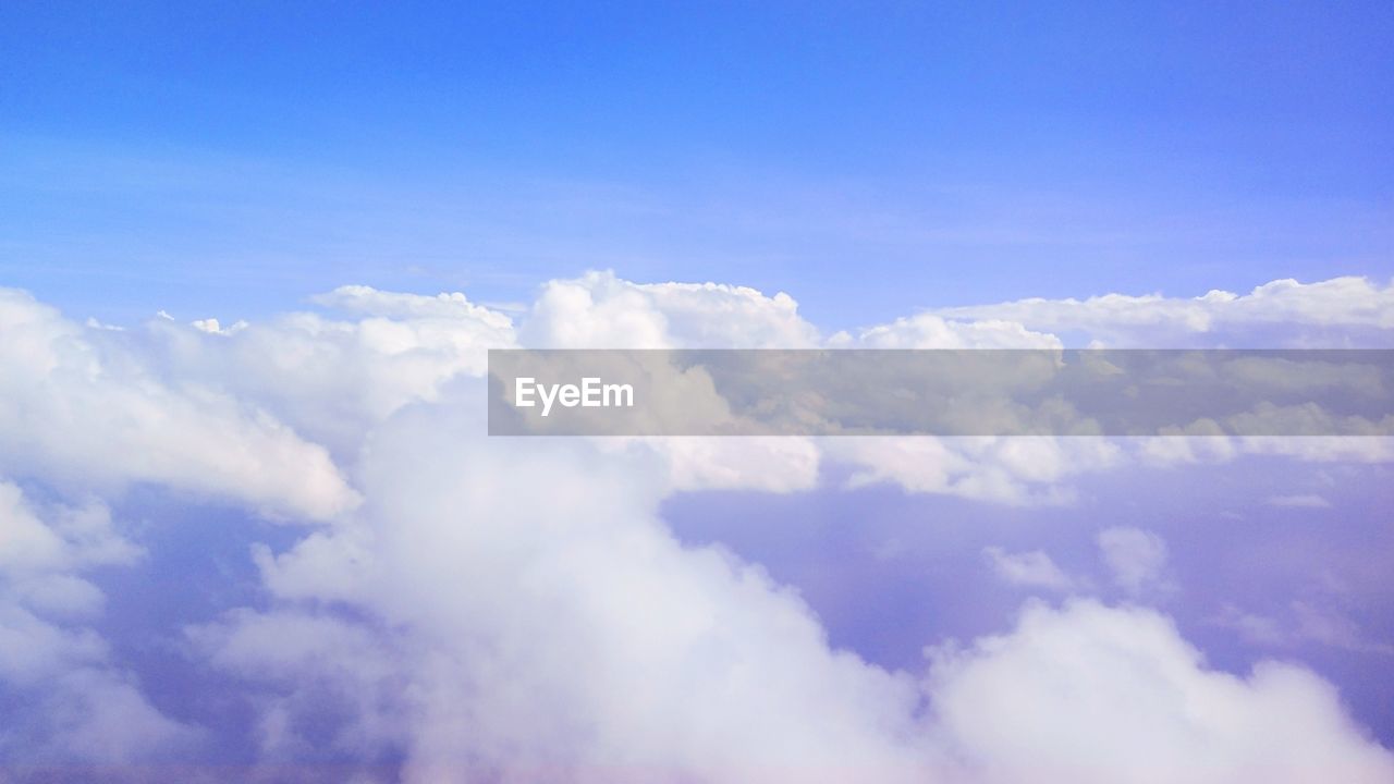 LOW ANGLE VIEW OF CLOUDS AGAINST BLUE SKY