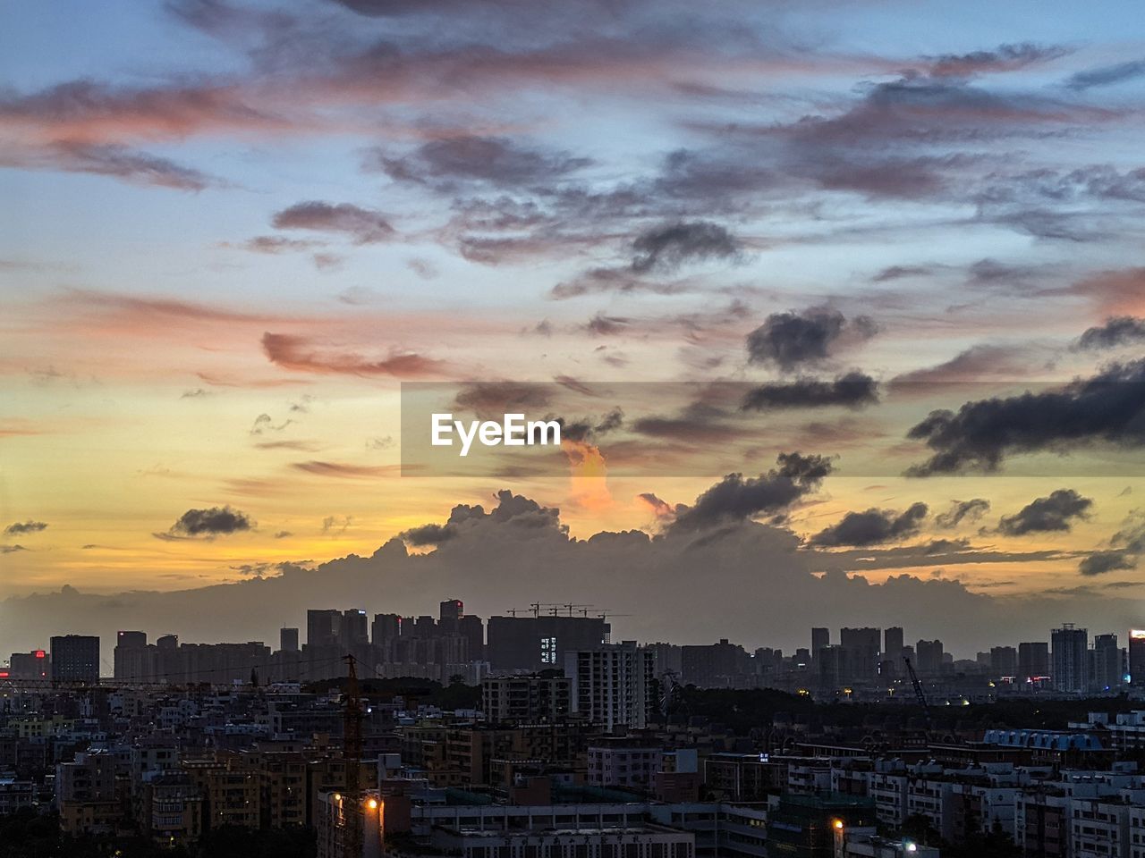 CITYSCAPE AGAINST SKY DURING SUNSET