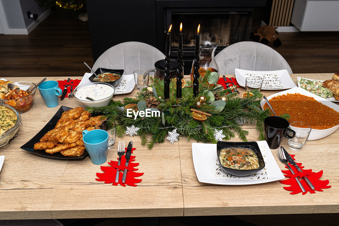 food and drink, food, table, meal, healthy eating, high angle view, no people, indoors, freshness, plate, brunch, vegetable, smörgåsbord, buffet, wellbeing, celebration, domestic life, furniture, drink, dinner, still life, wood, supper, domestic room, lifestyles, fast food
