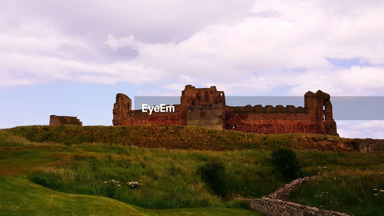 Castle against cloudy sky