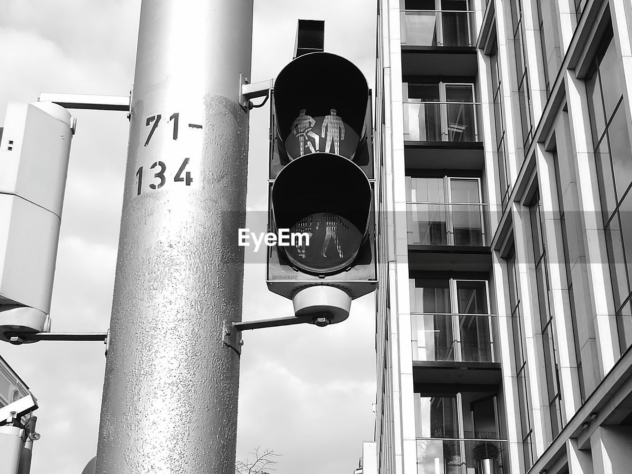 Low angle view of road sign against sky