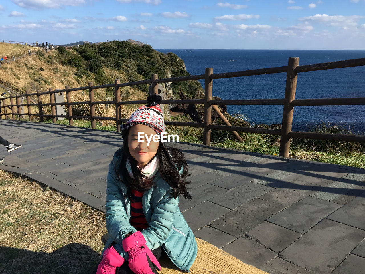 Little girl sitting with a beautiful view in taiwan