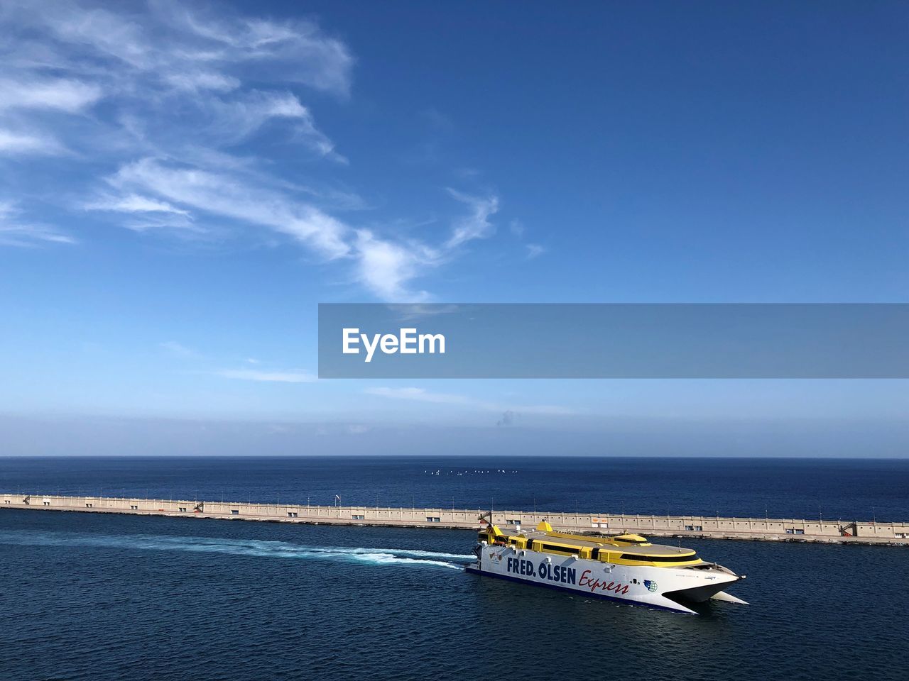 Scenic view of sea against blue sky