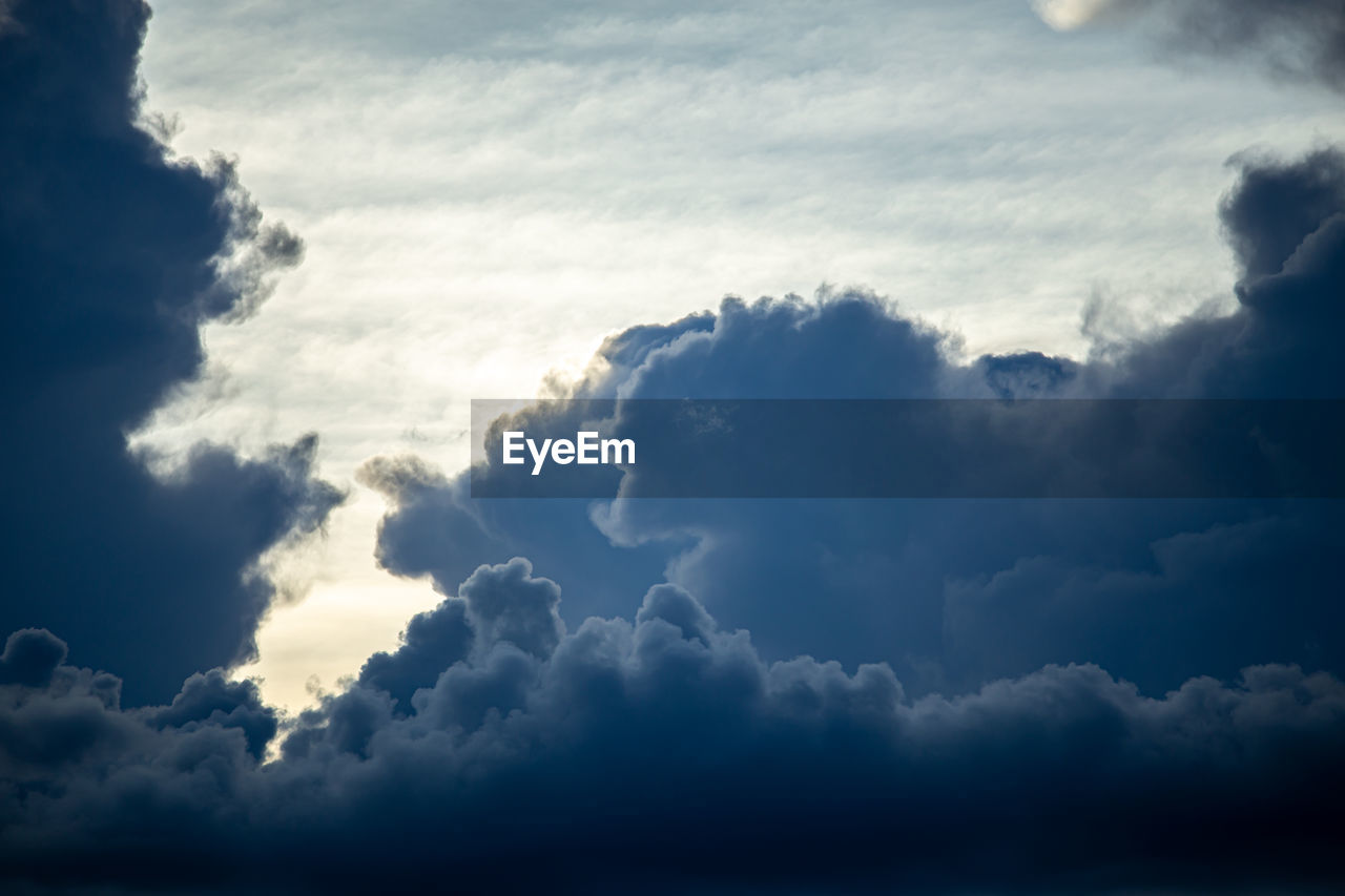 sky, cloud, beauty in nature, cloudscape, nature, environment, scenics - nature, dramatic sky, storm, storm cloud, blue, no people, backgrounds, outdoors, thunderstorm, overcast, idyllic, sunlight, tranquility, wind, water, horizon, atmosphere, awe, landscape, meteorology, daytime, tranquil scene, day, cumulonimbus, summer