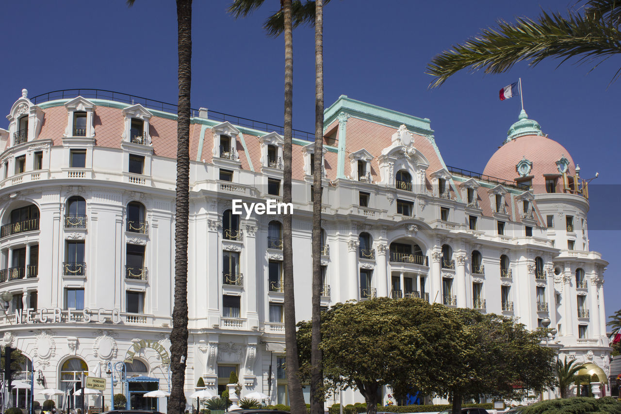 View of buildings against blue sky