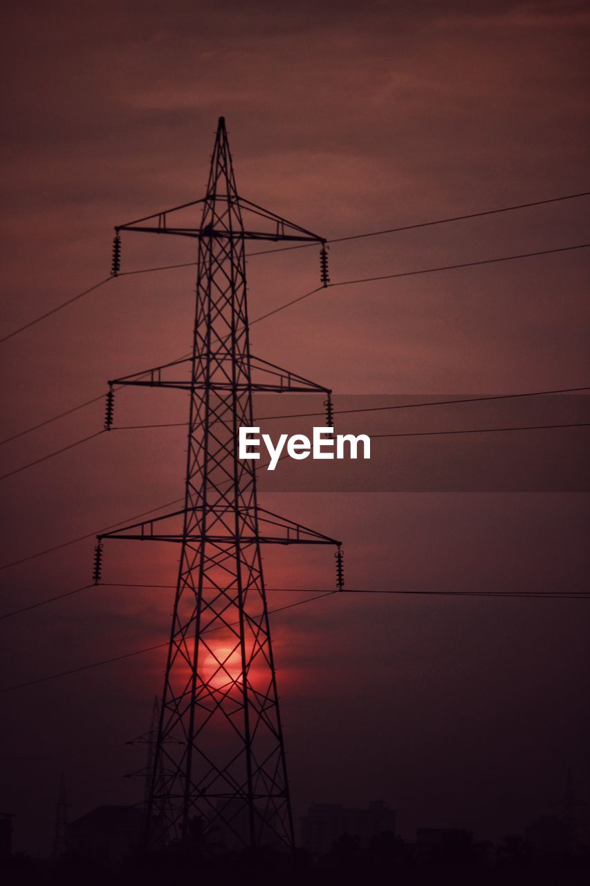 LOW ANGLE VIEW OF ELECTRICITY PYLON AGAINST ROMANTIC SKY