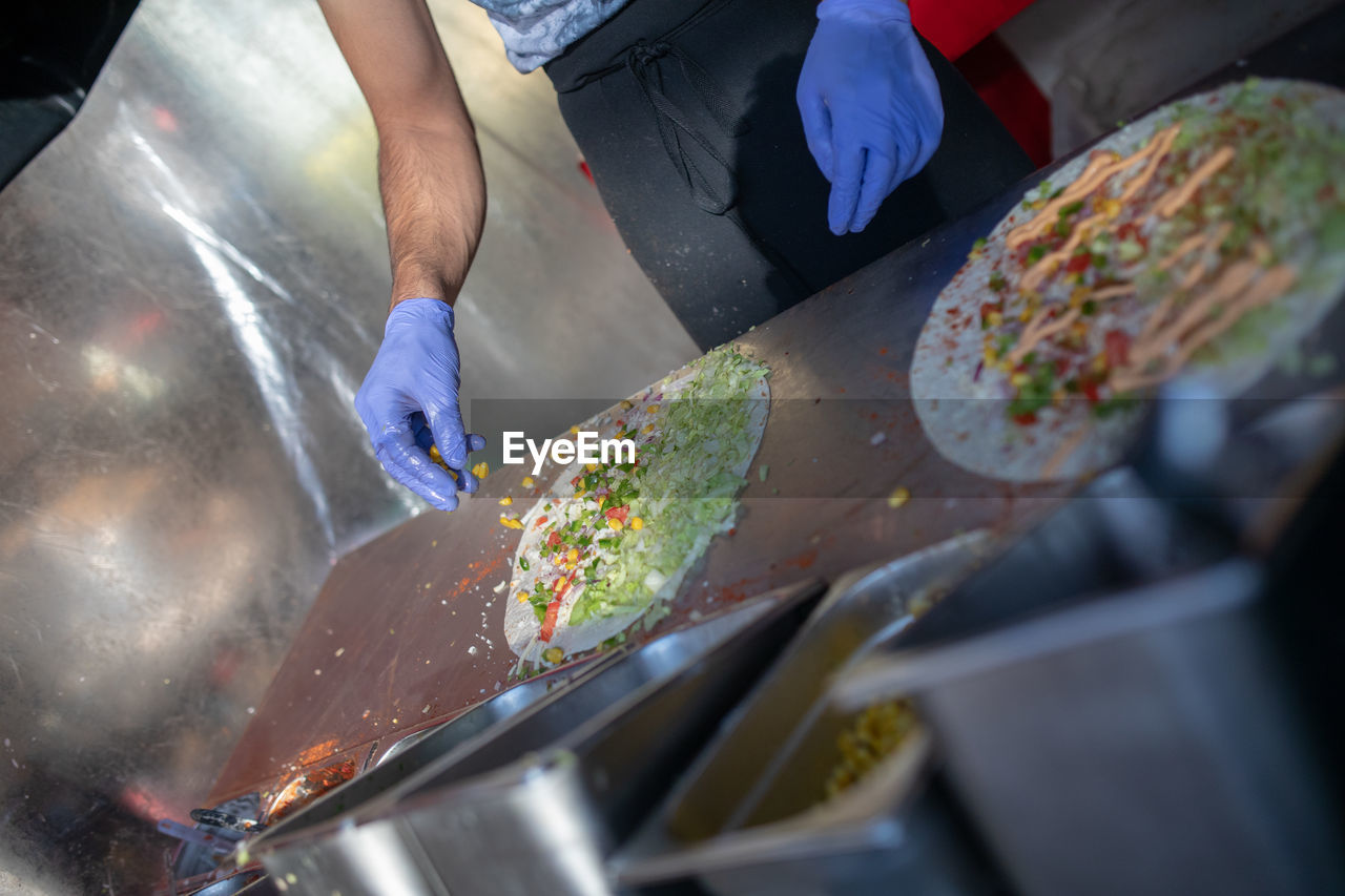 Midsection of man preparing food