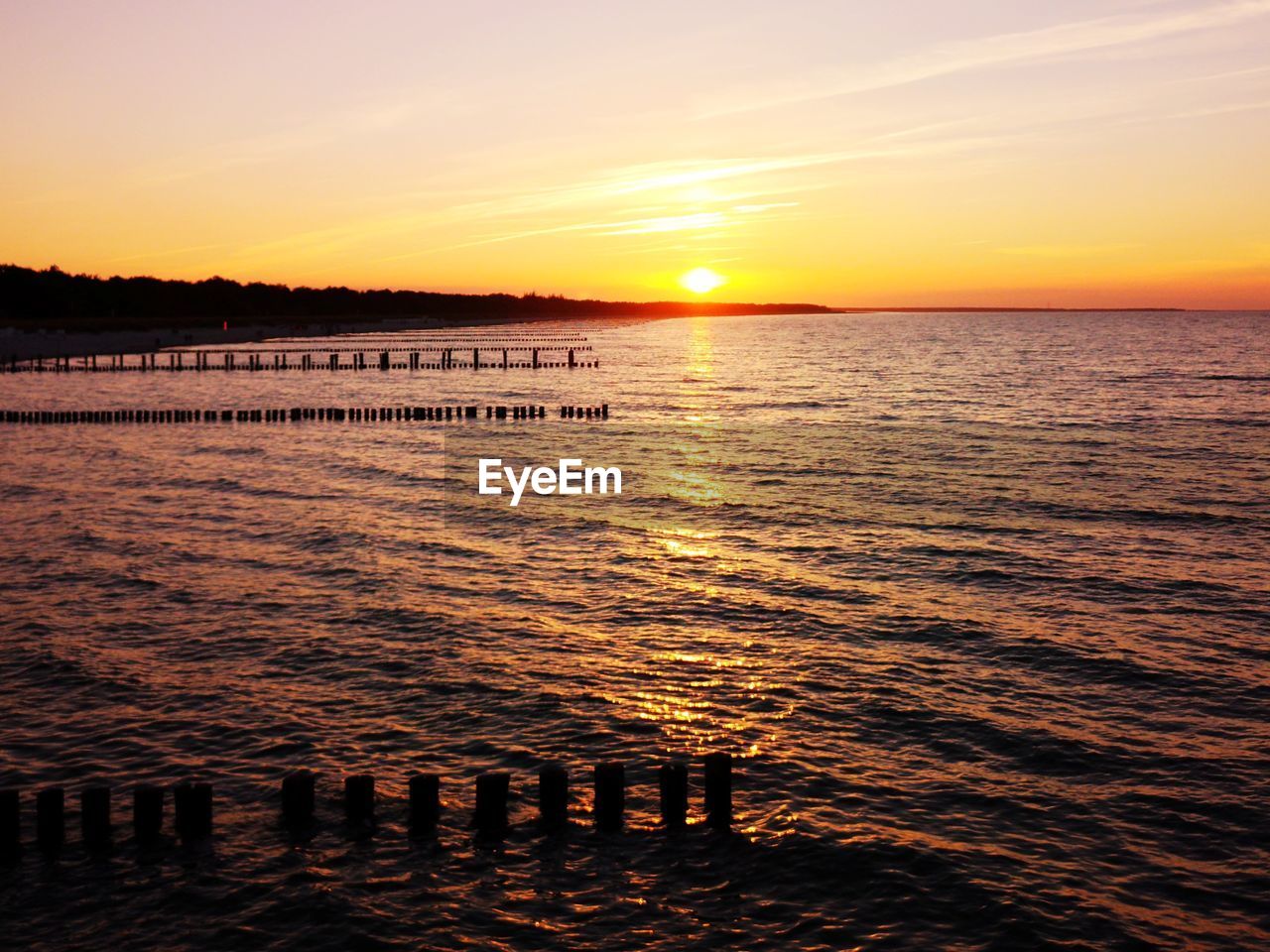 Scenic view of sea against sky during sunset at zingst / ostsee