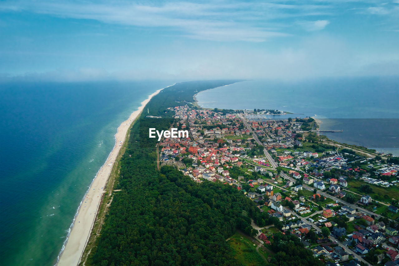Sea landscape with sandy beach and jastarnia city on hel peninsula. baltic sea coast in poland