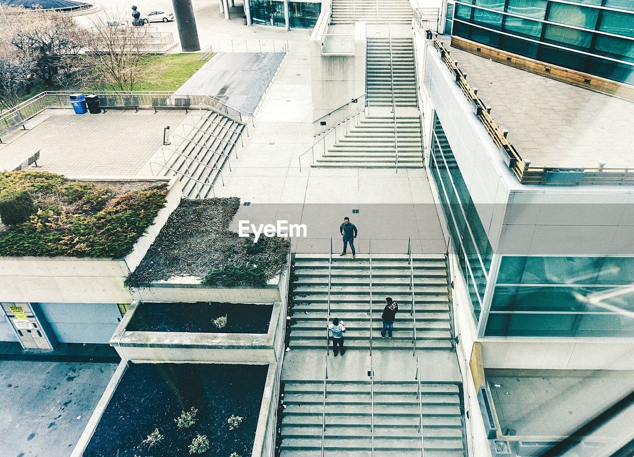 High angle view of people walking on stairs