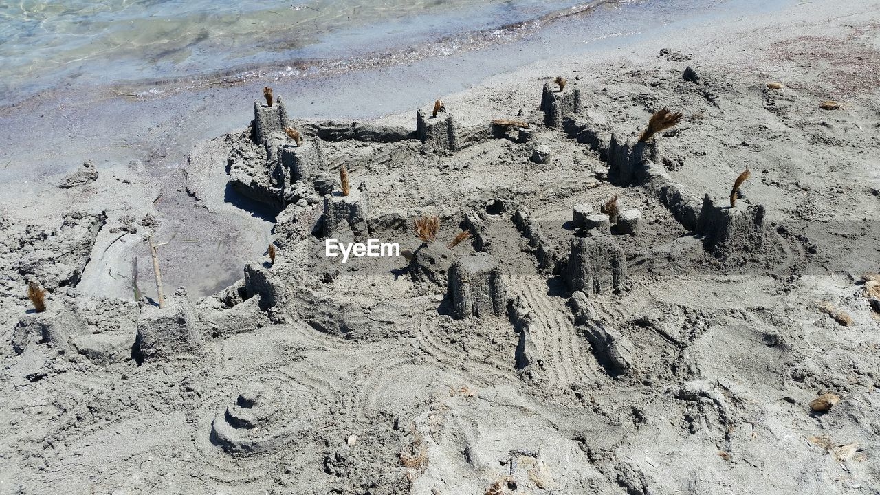 High angle view of sand castle on sandy beach