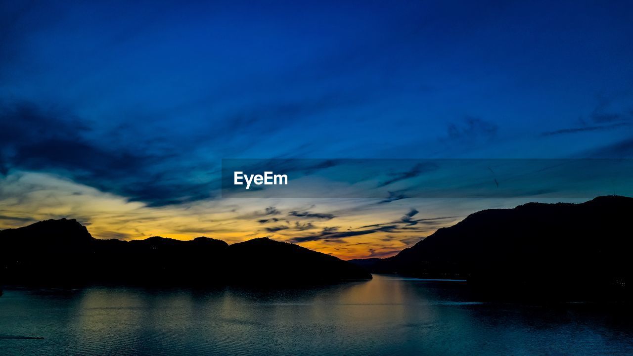 Scenic view of sea against sky at sunset