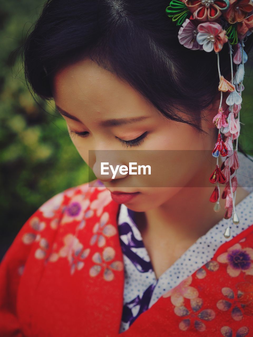 Close-up of teenage girl wearing kimono while standing outdoors