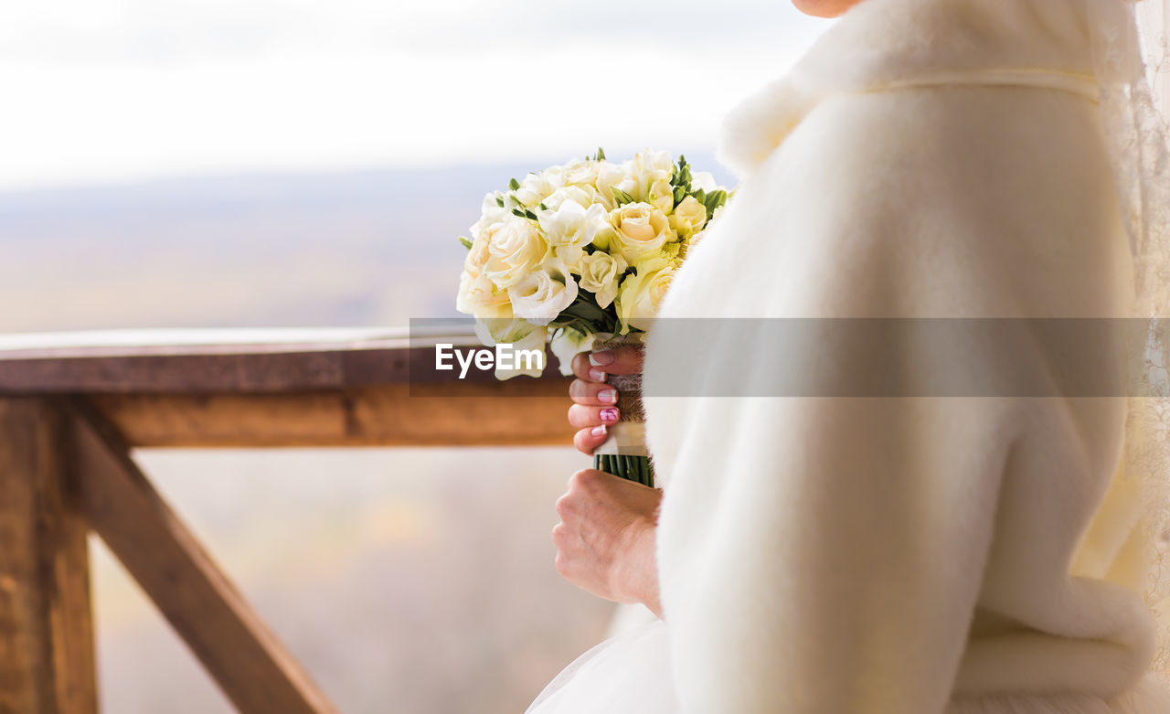 Close-up of white flower holding bouquet