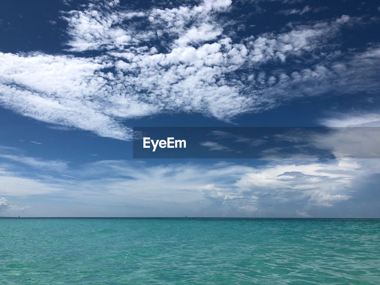 SCENIC VIEW OF SEASCAPE AGAINST SKY