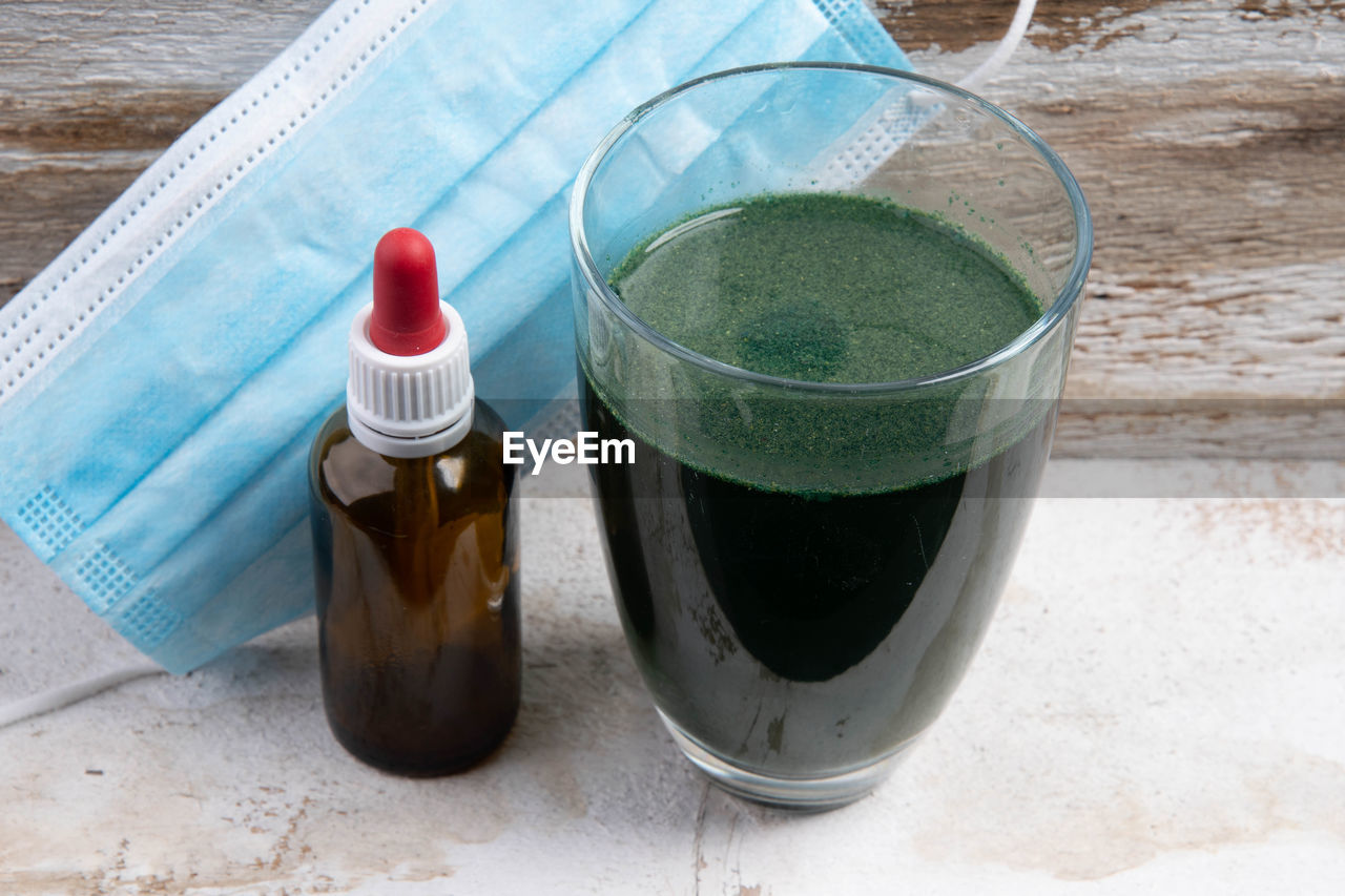 Green smoothie with  brown glass bottle