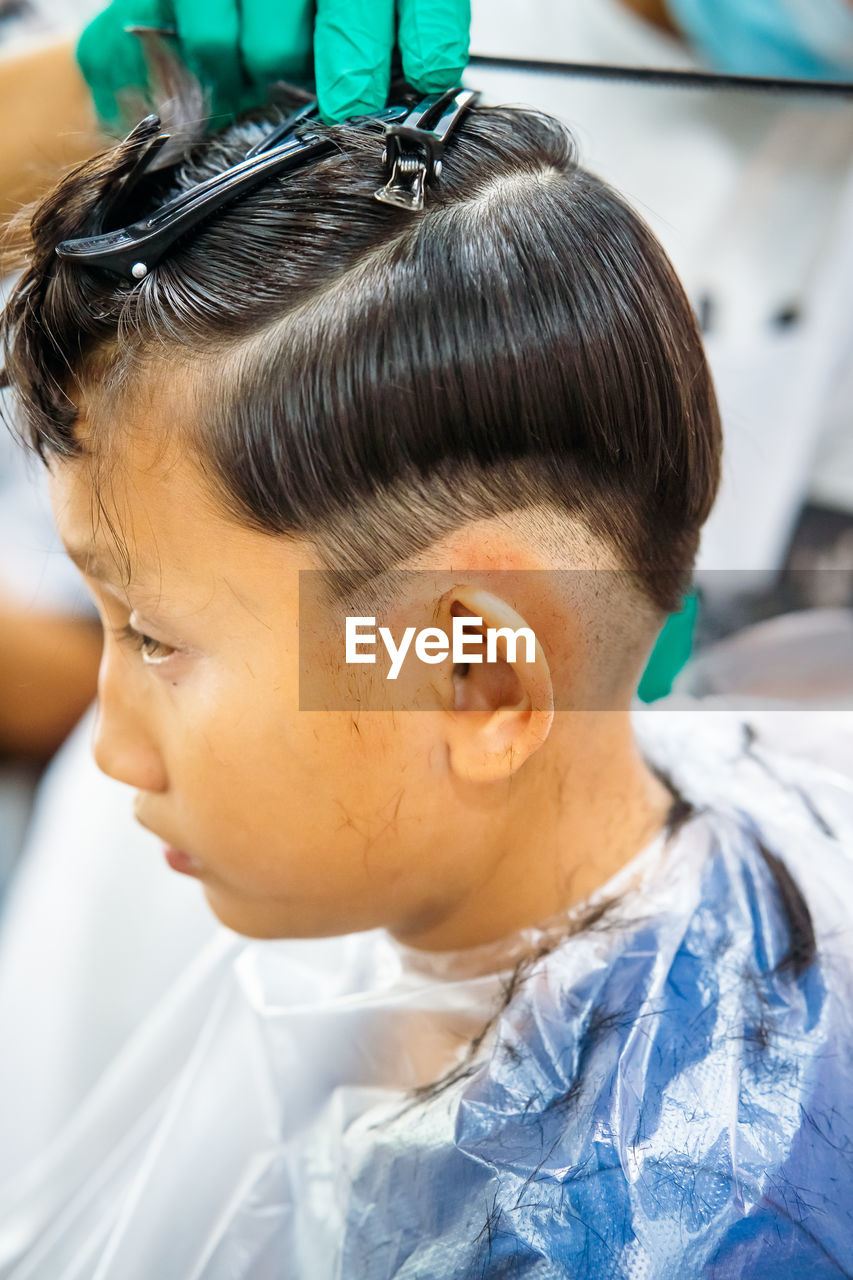 CLOSE-UP PORTRAIT OF CUTE BOY WITH EYES CLOSED