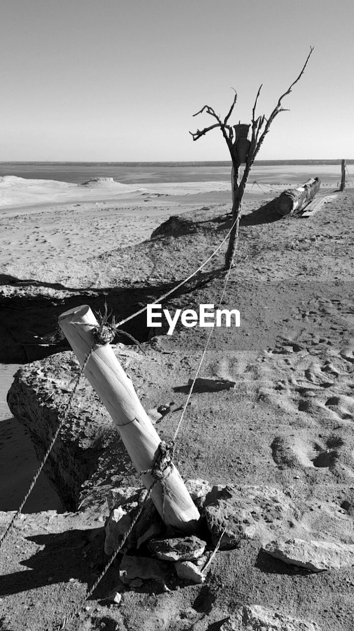 TILT IMAGE OF BEACH AGAINST SKY