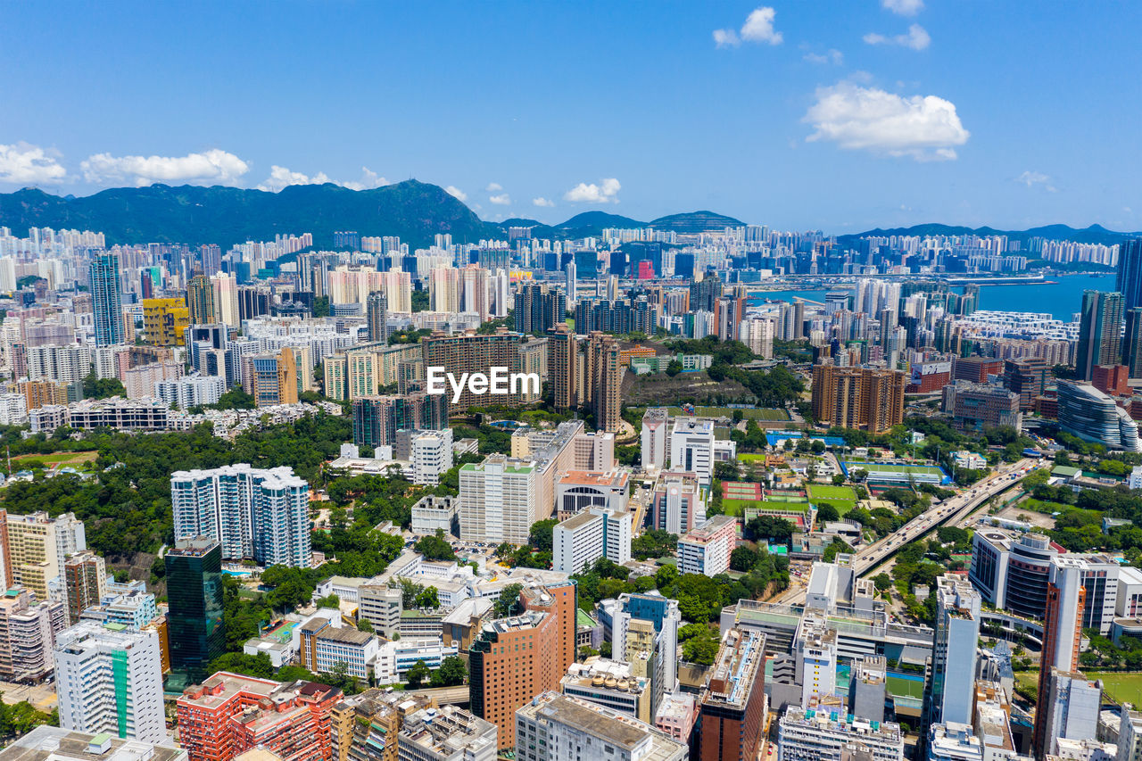 High angle view of buildings in city against sky