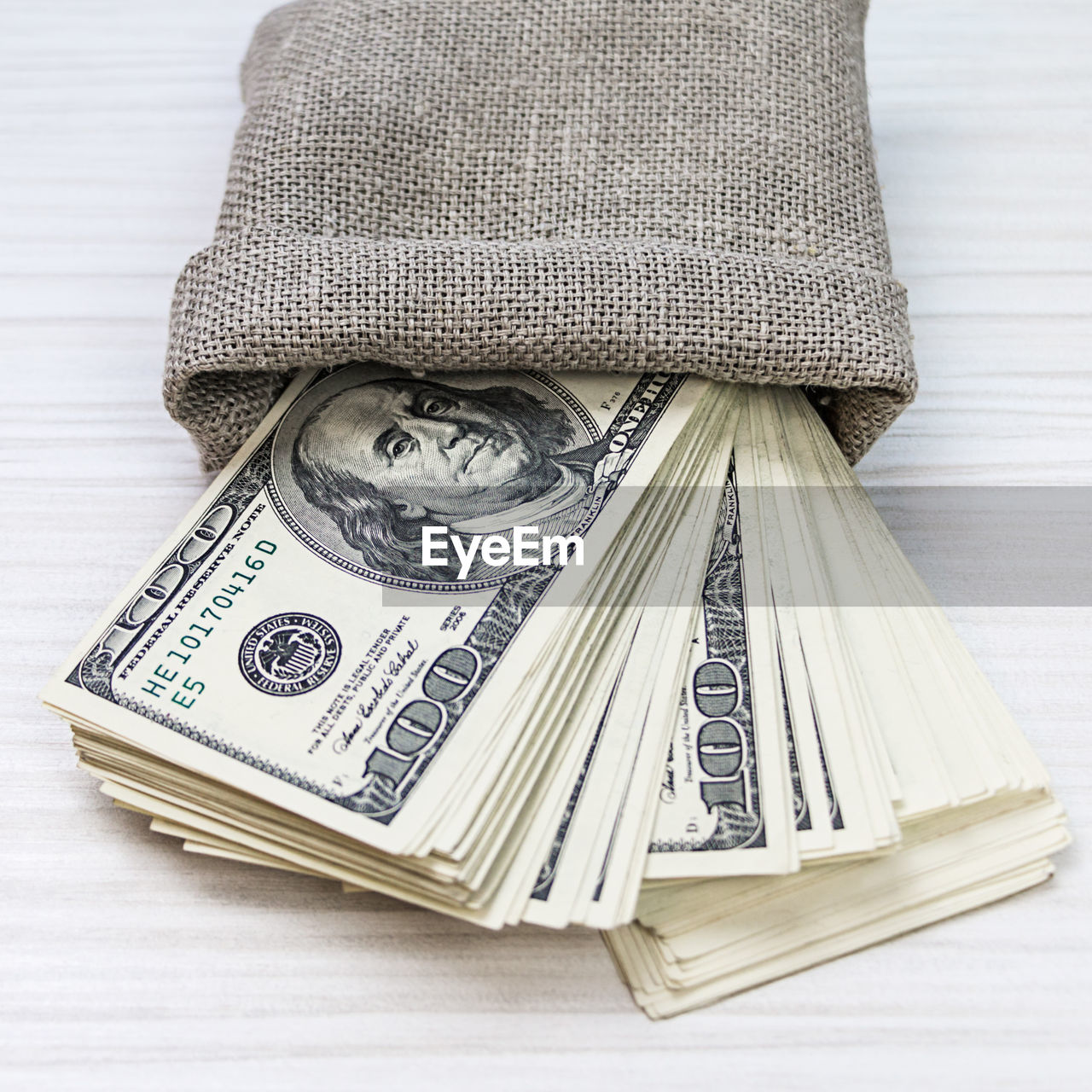 Close-up of paper currency in sack on table