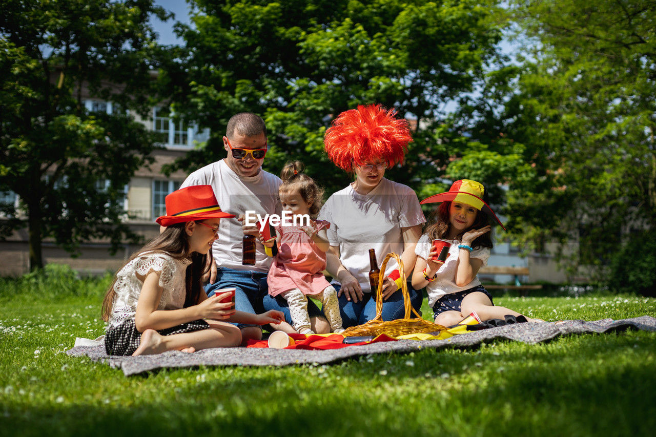 Portrait of a young family with children on a picnic.