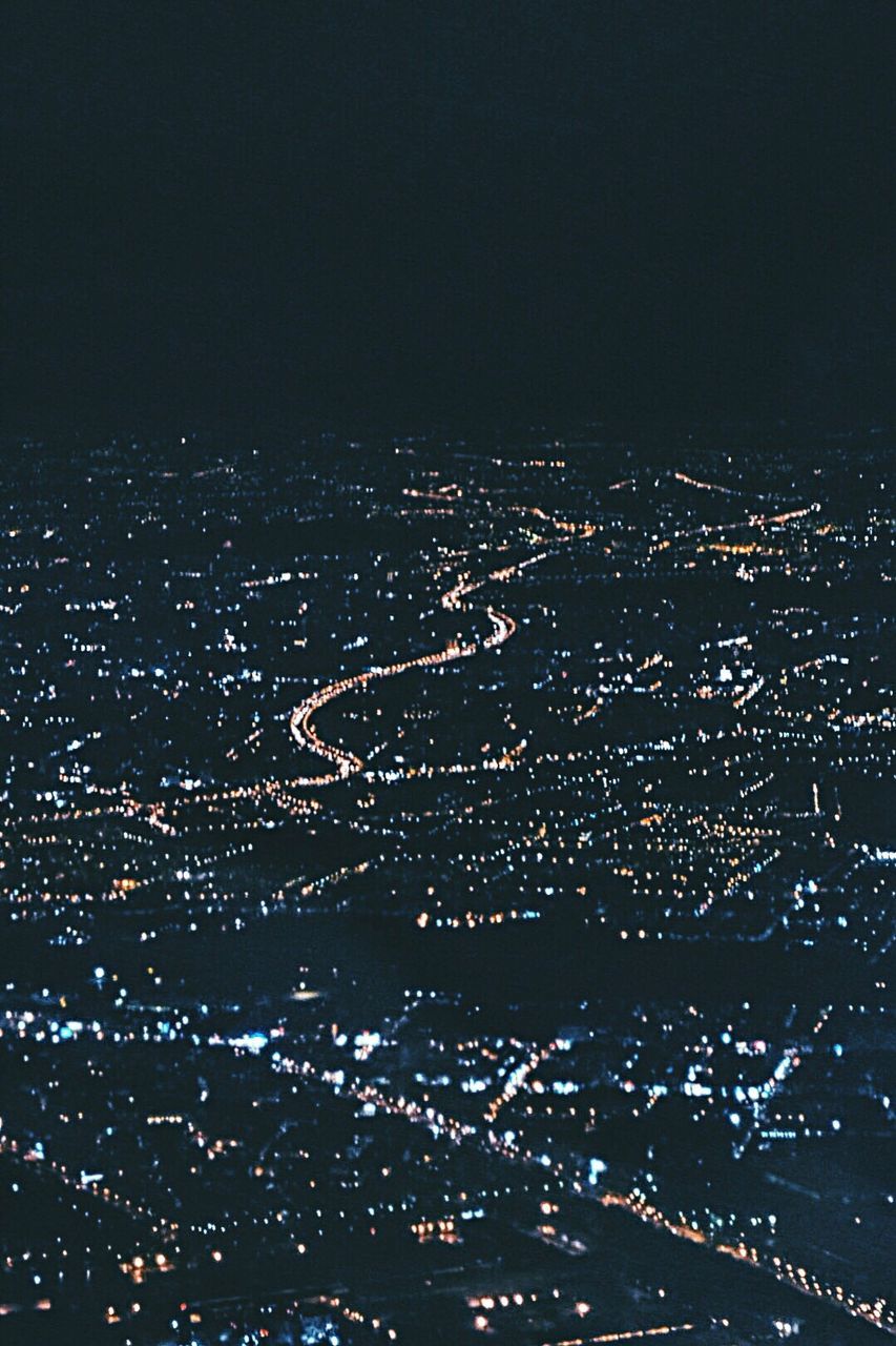 ILLUMINATED CITYSCAPE AT NIGHT