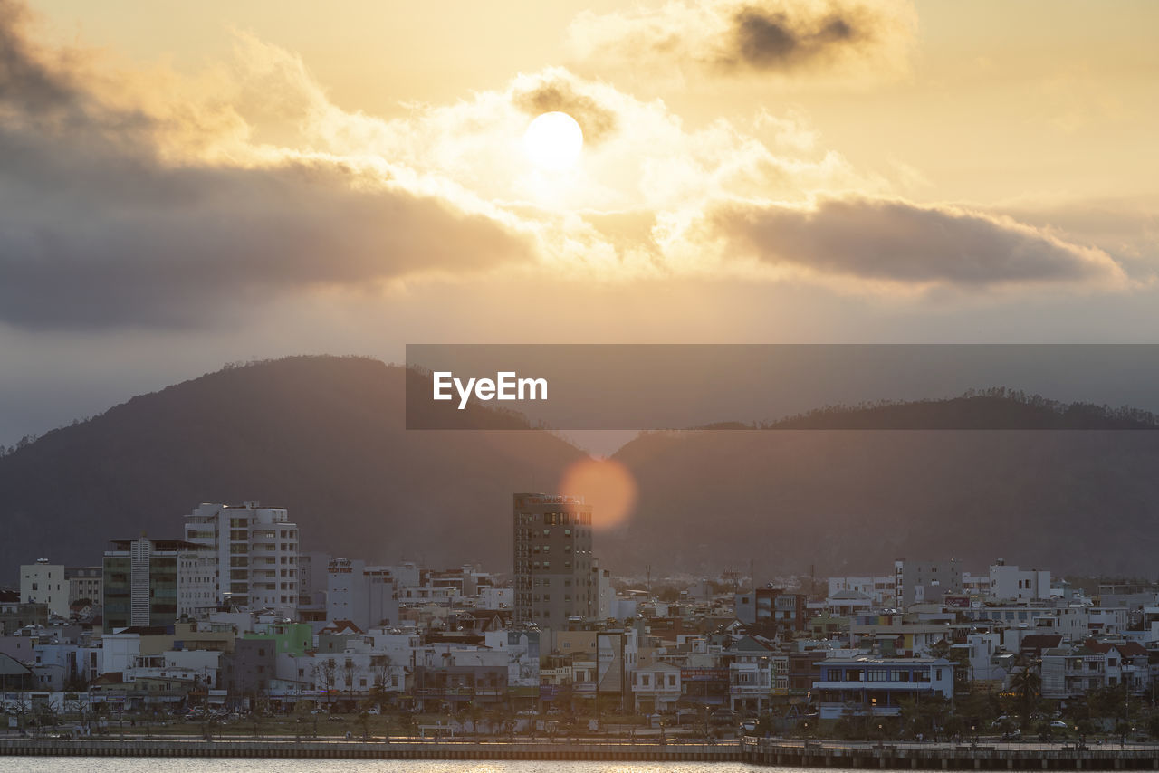 Cityscape against sky during sunset