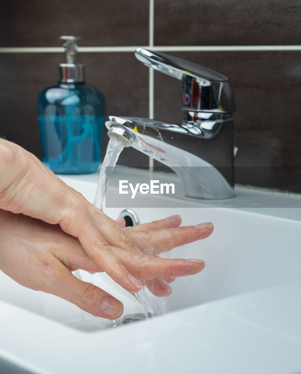 MIDSECTION OF PERSON IN BATHTUB