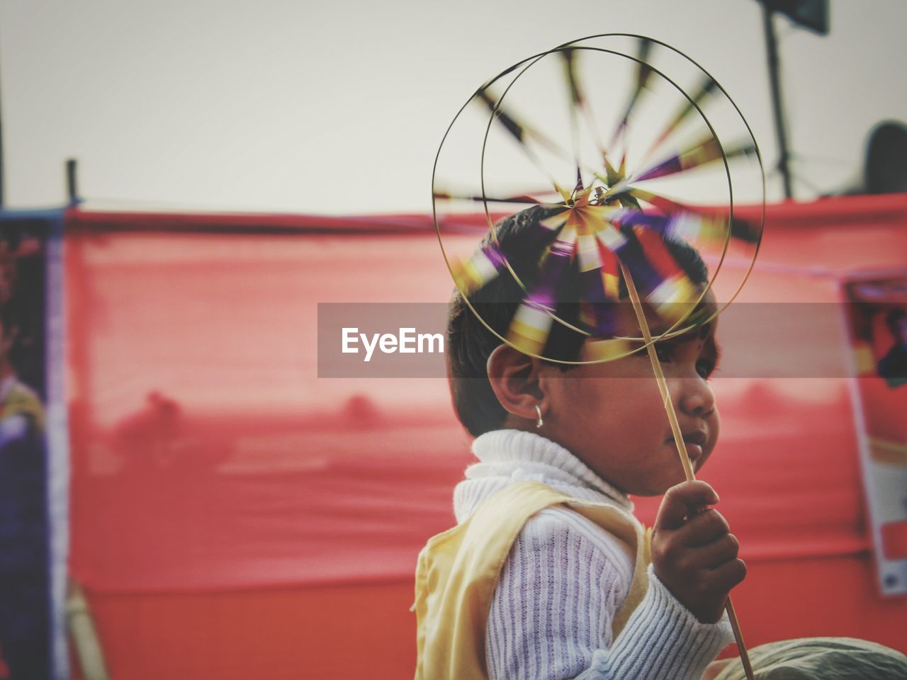 Close-up of girl holding pinwheel