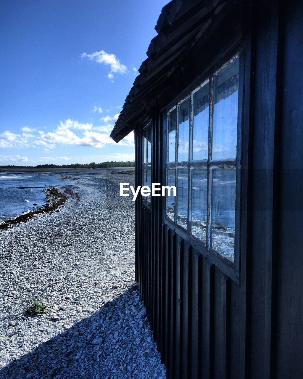 Built structure at beach against sky