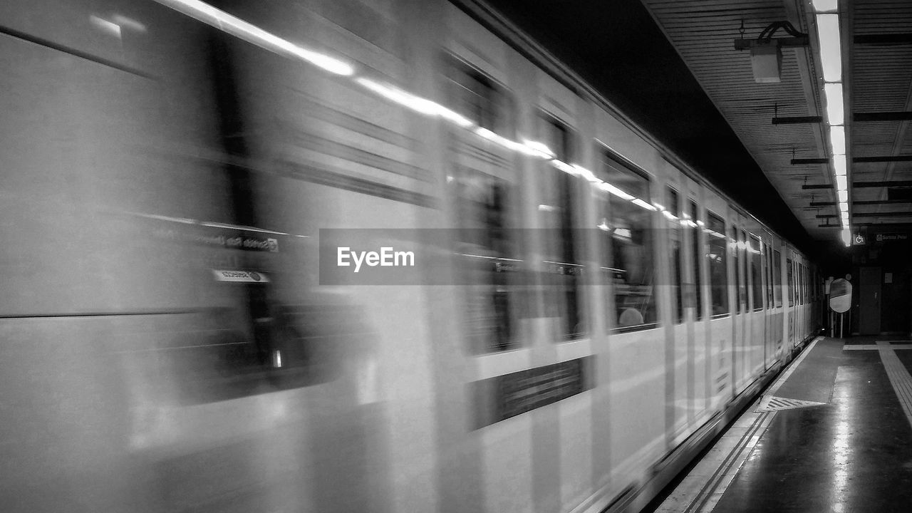 BLURRED MOTION OF TRAIN AT STATION