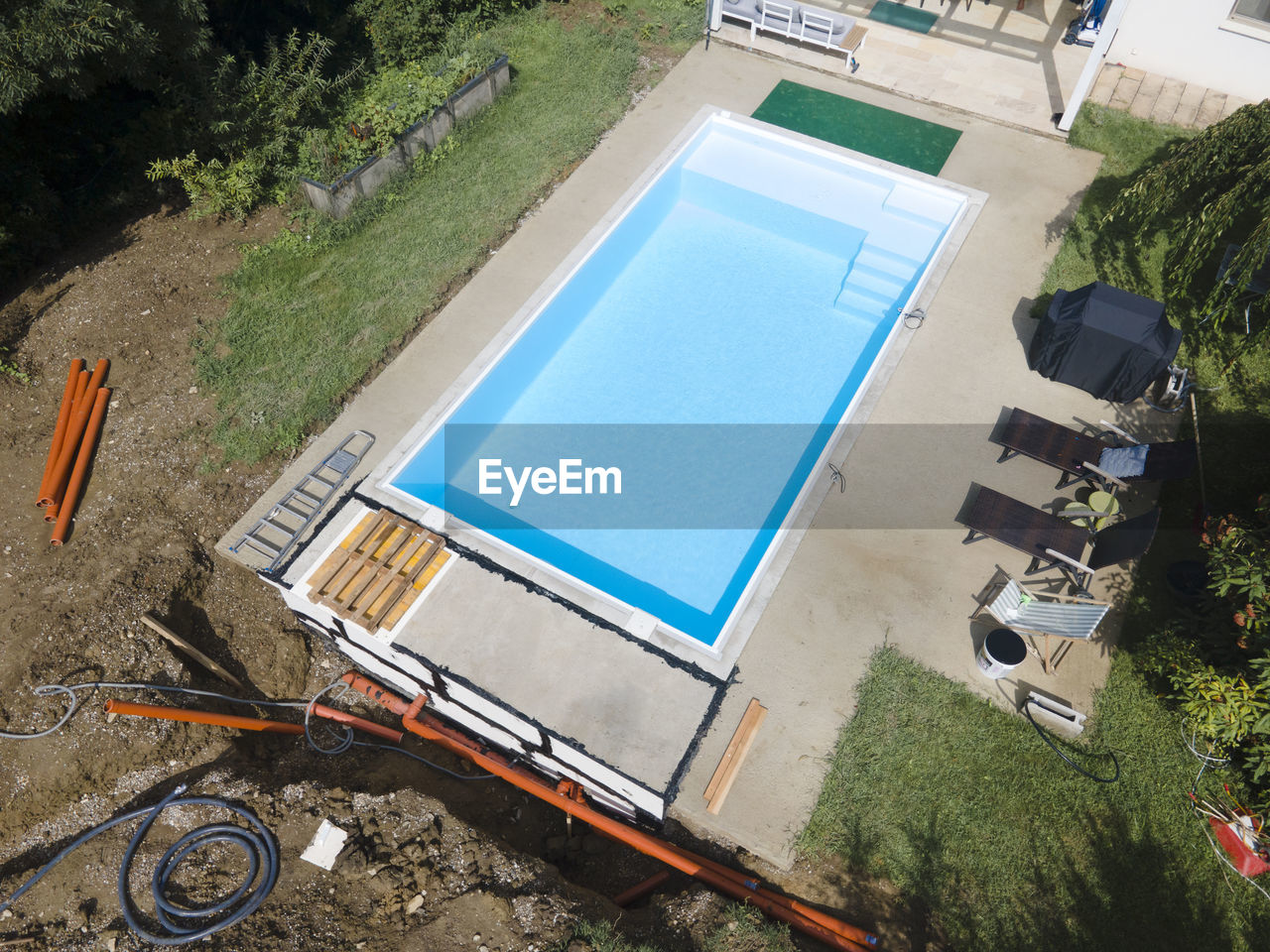 HIGH ANGLE VIEW OF POOL ON FIELD