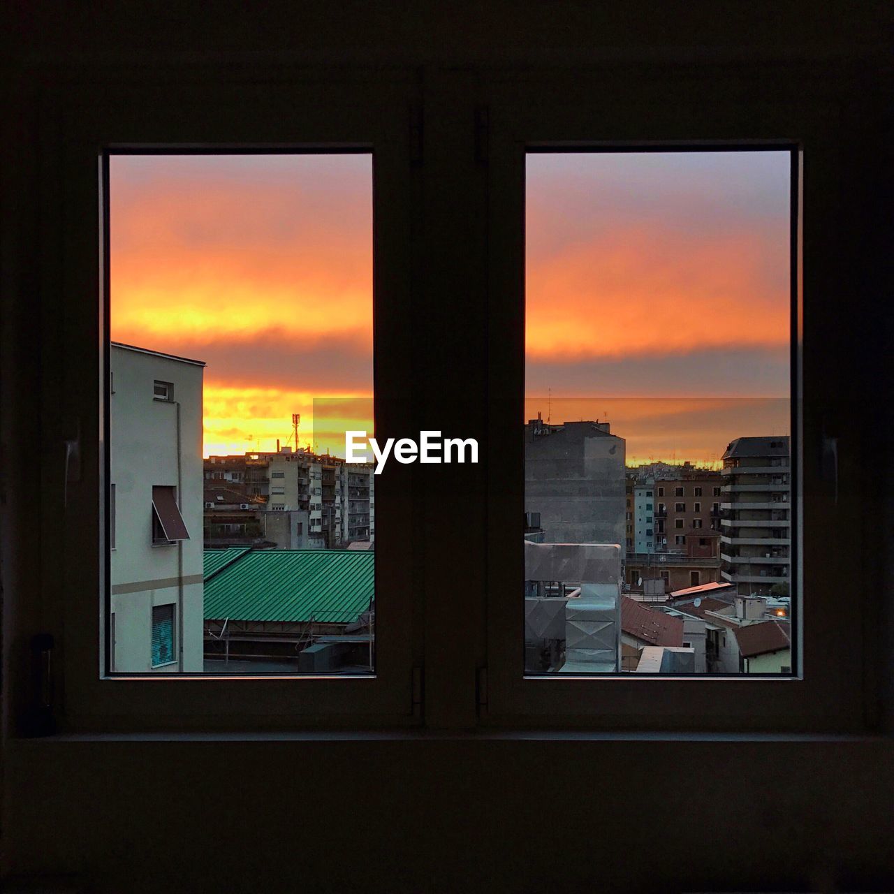 VIEW OF CITY THROUGH WINDOW