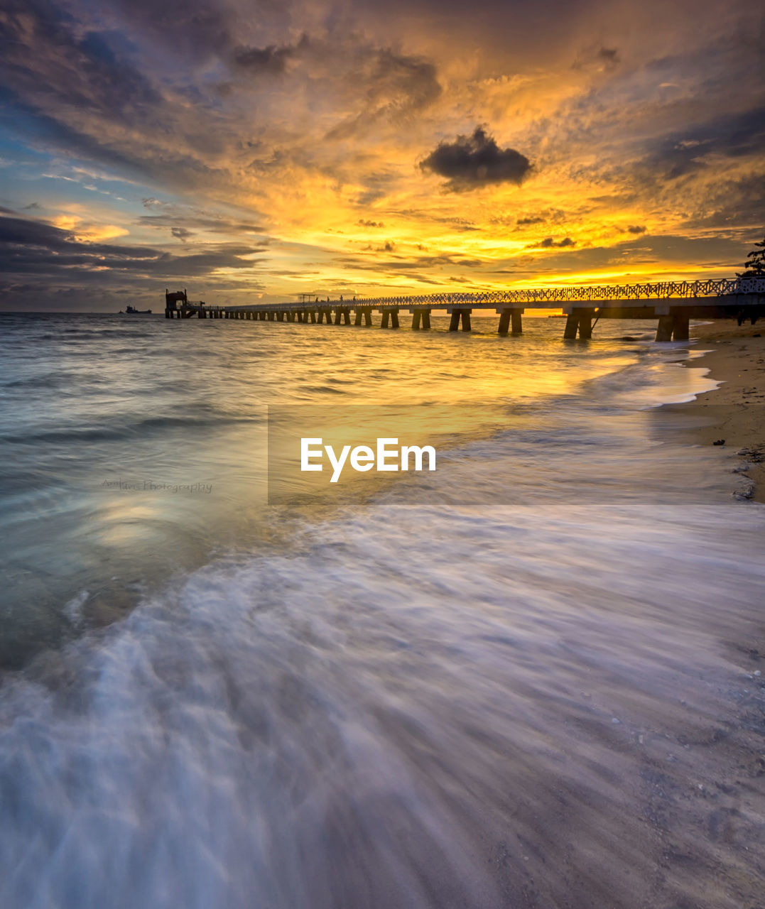 Scenic view of beach against sky during sunset